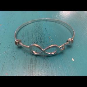 Silver bangle bracelet with infinity design